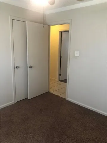 a bathroom with a toilet a sink and a mirror