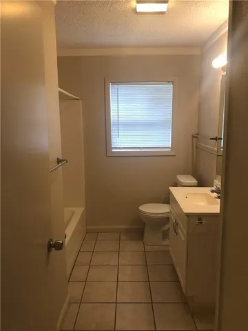 a view of an empty room and a window