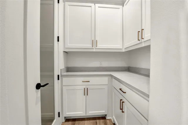 a view of cabinets and utility room