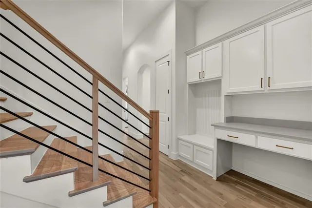 a view of a patio with a table and chairs and floor to ceiling window
