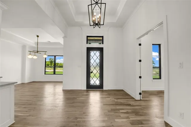 a view of livingroom with hardwood floor and hallway