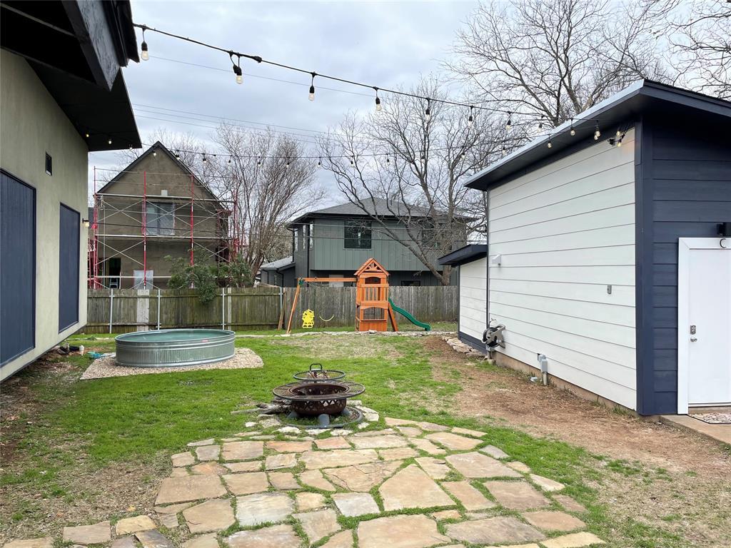 4619 Jinx Avenue, Unit A Austin, TX 78745 - Photo 15 of 15 Fenced backyard with a playground and a fire pit