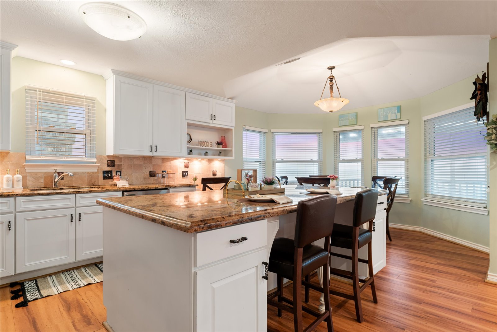 24043 Termini-San Luis Pass Road Galveston, TX 77554 - Photo 12 of 26 a kitchen with a sink stove and cabinets