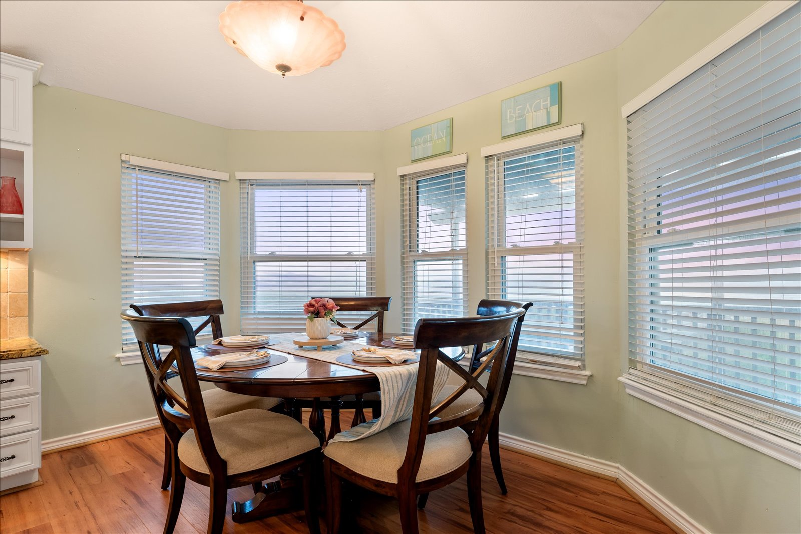 24043 Termini-San Luis Pass Road Galveston, TX 77554 - Photo 14 of 26 a view of a dining room with furniture windows and wooden floor