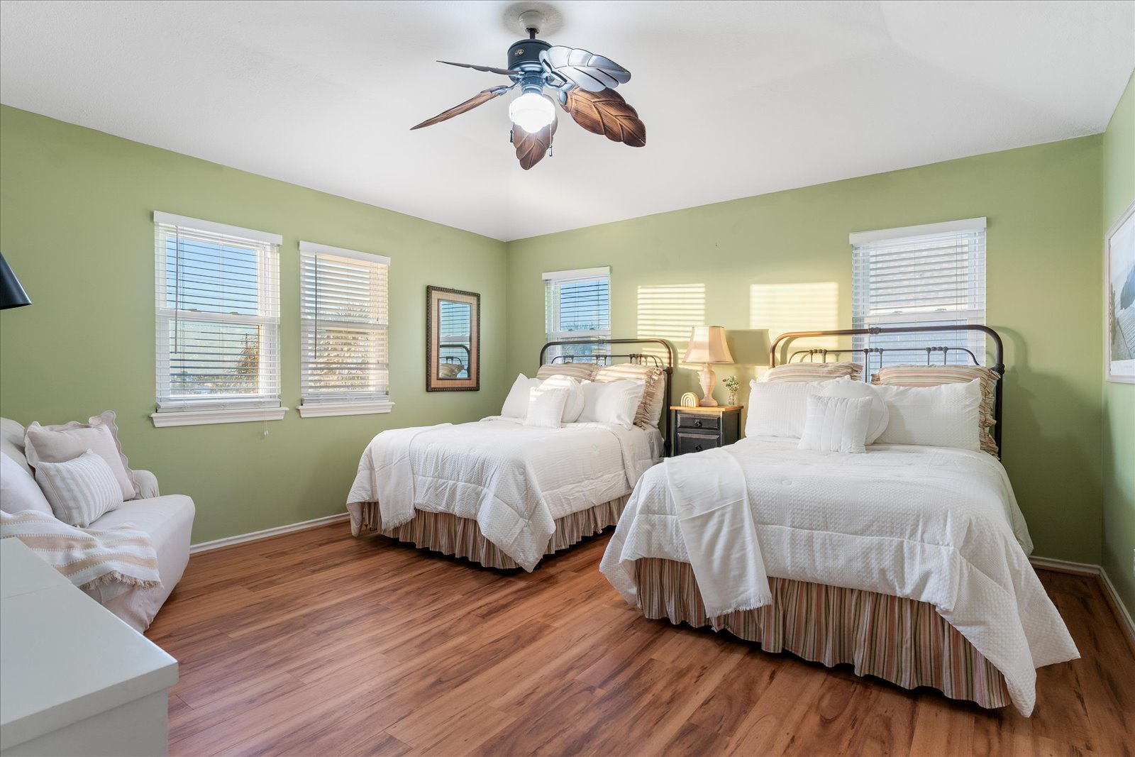 24043 Termini-San Luis Pass Road Galveston, TX 77554 - Photo 15 of 26 a bedroom with two beds and a chandelier