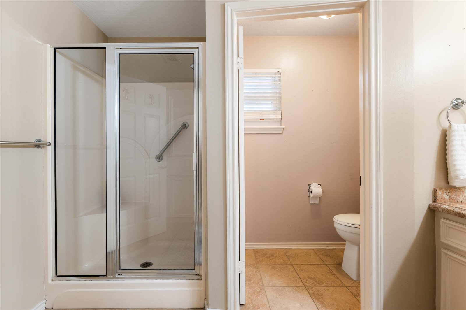 24043 Termini-San Luis Pass Road Galveston, TX 77554 - Photo 19 of 26 a bathroom with a glass door shower