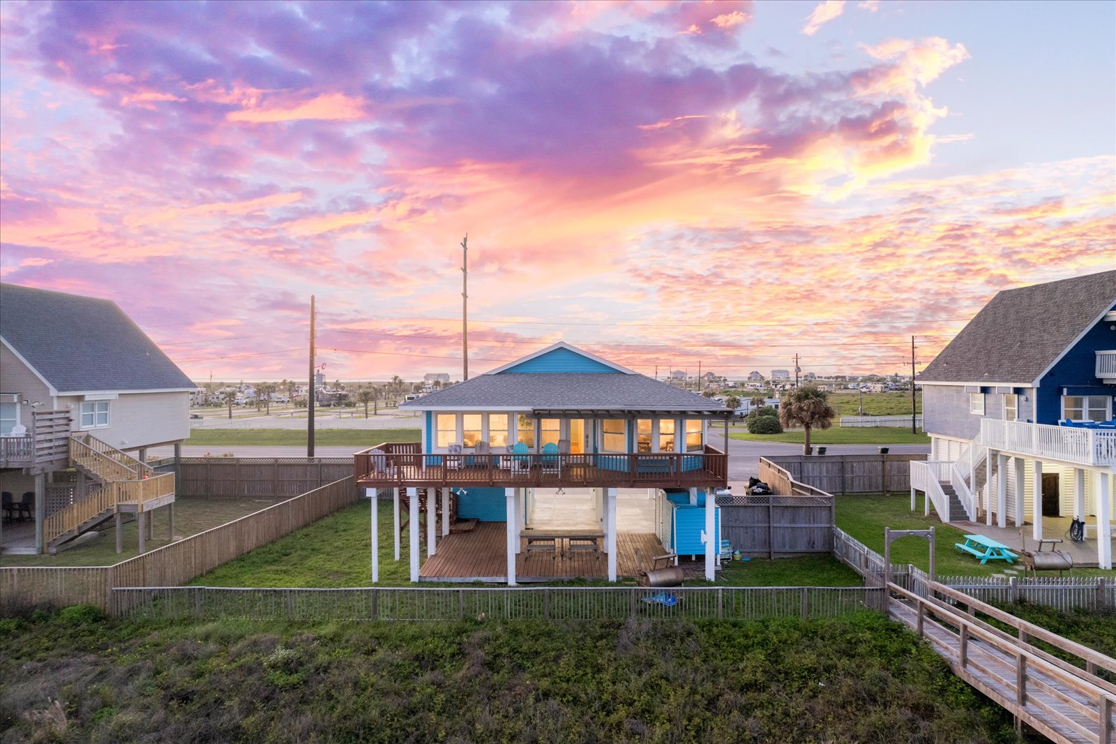 24043 Termini-San Luis Pass Road Galveston, TX 77554 - Photo 2 of 26 a view of a garden with a deck
