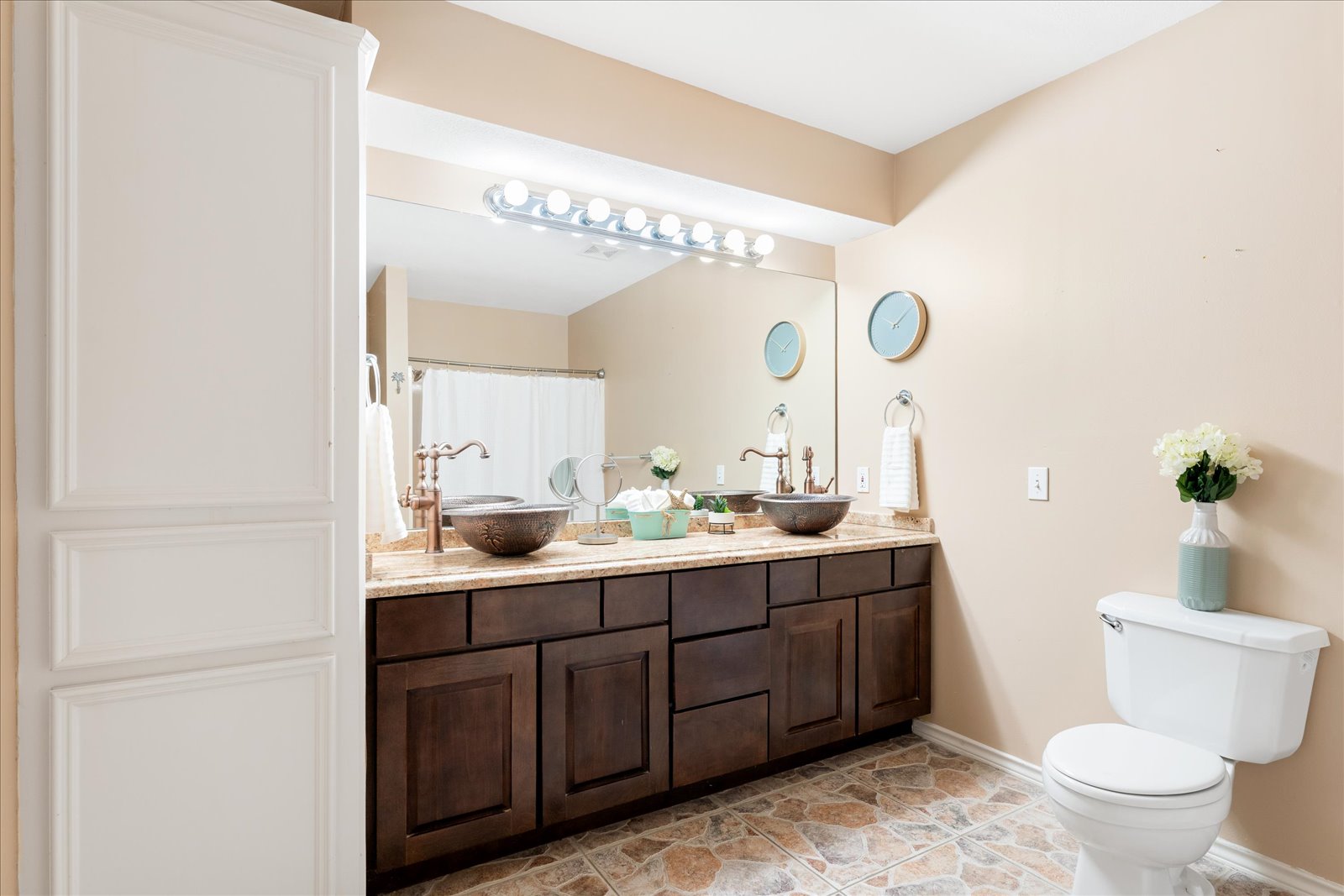 24043 Termini-San Luis Pass Road Galveston, TX 77554 - Photo 21 of 26 a bathroom with a double vanity sink mirror and toilet
