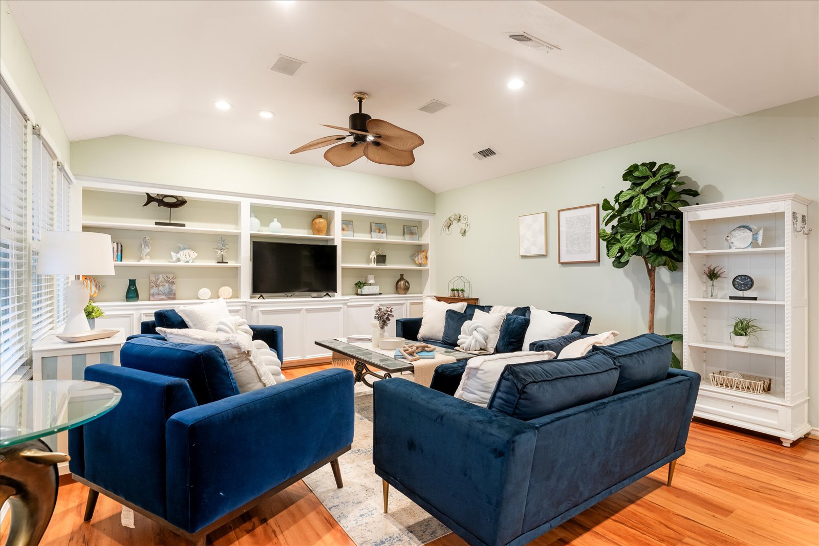 24043 Termini-San Luis Pass Road Galveston, TX 77554 - Photo 8 of 26 a living room with furniture a flat screen tv and a large window