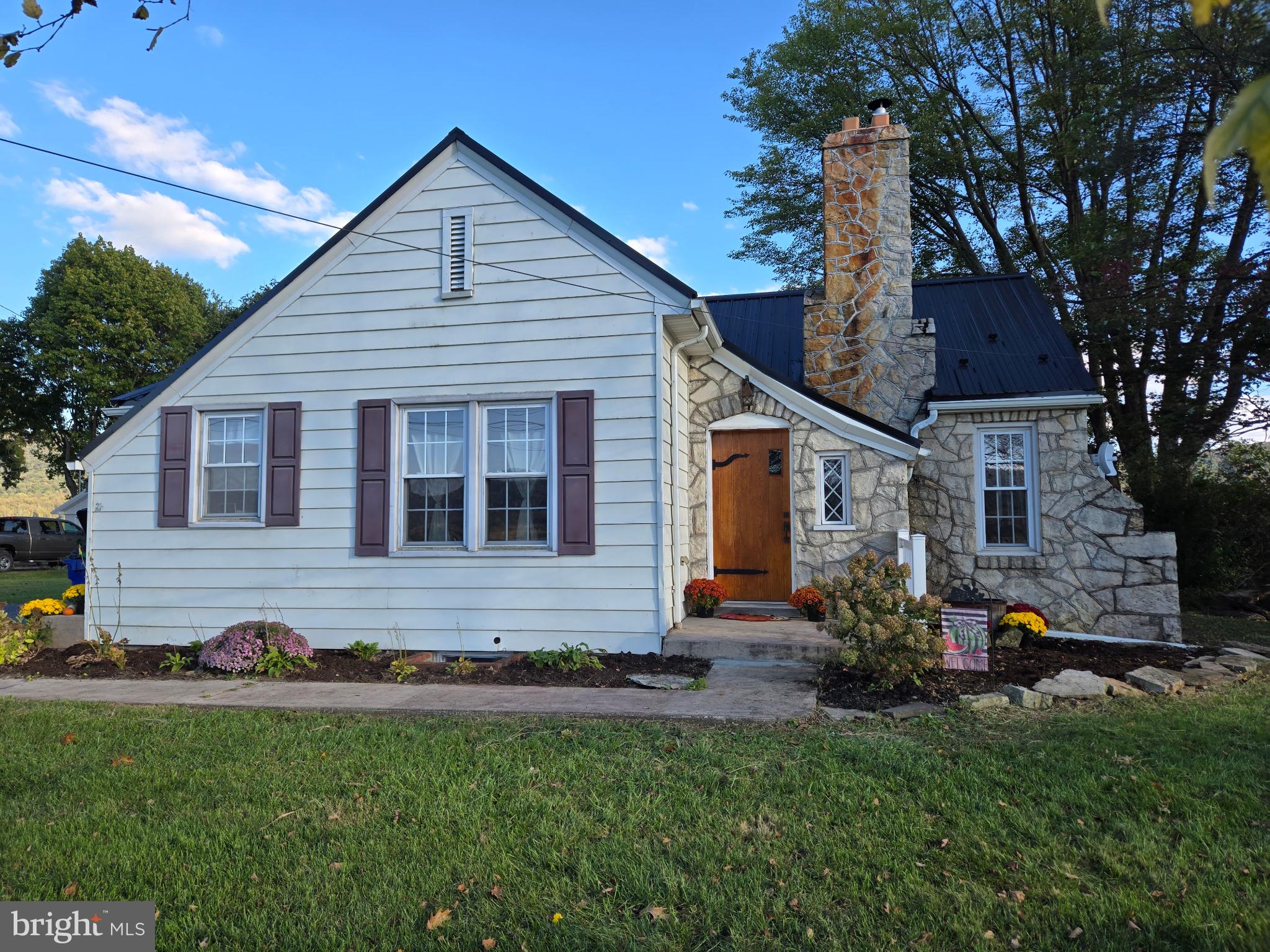 18452 Path Valley Road Dry Run, PA 17220 - Photo 1 of 45 a front view of house with yard and green space