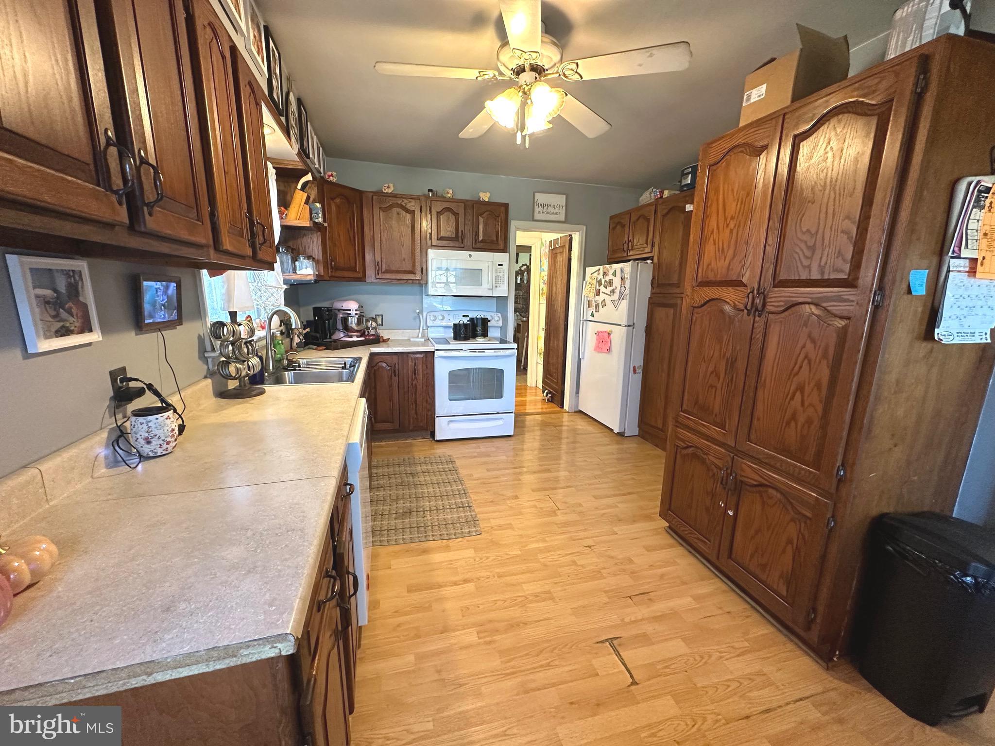 18452 Path Valley Road Dry Run, PA 17220 - Photo 11 of 45 a kitchen with stainless steel appliances granite countertop a refrigerator a oven and white cabinets