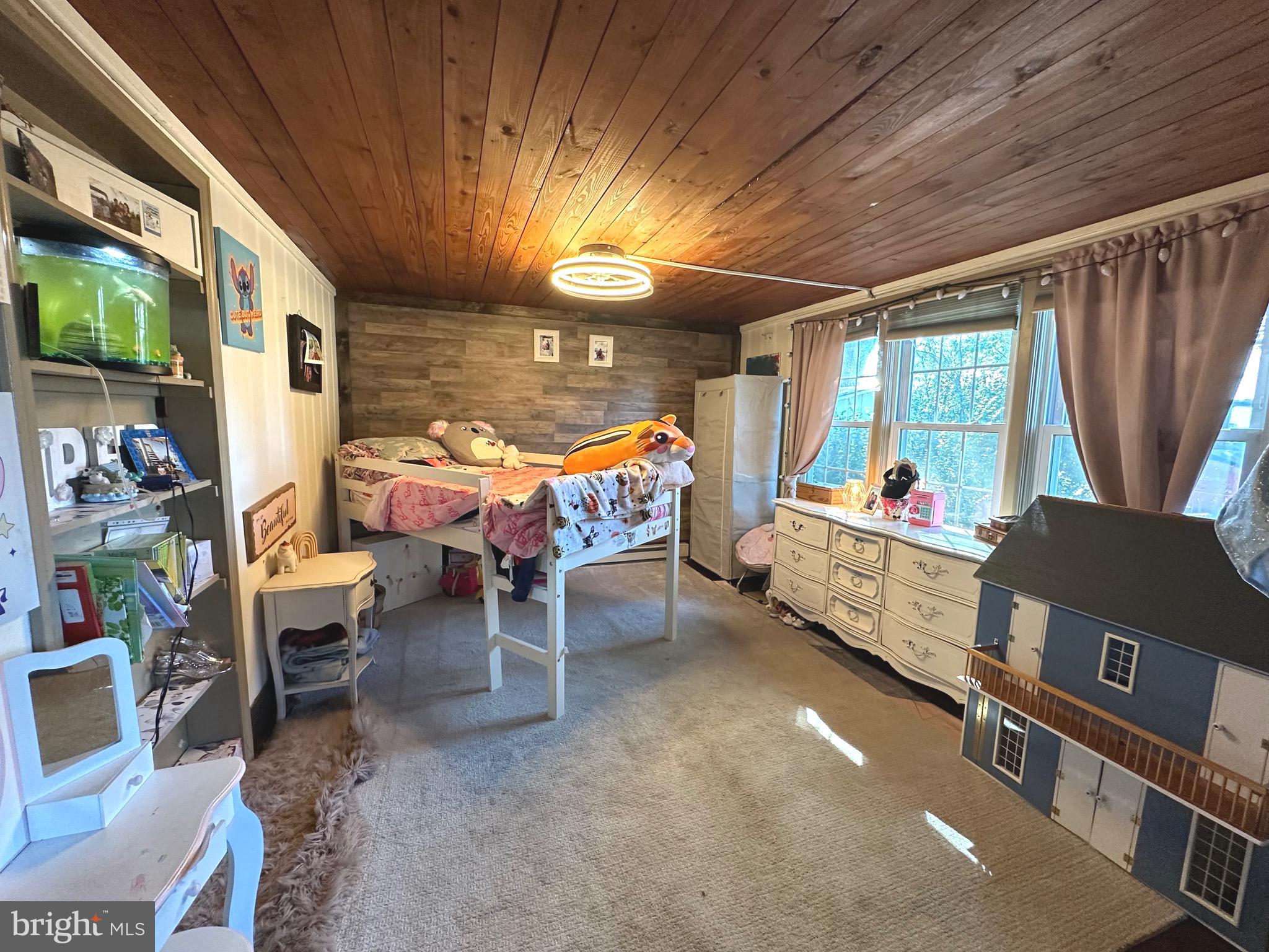 18452 Path Valley Road Dry Run, PA 17220 - Photo 19 of 45 a bed room with furniture and a window