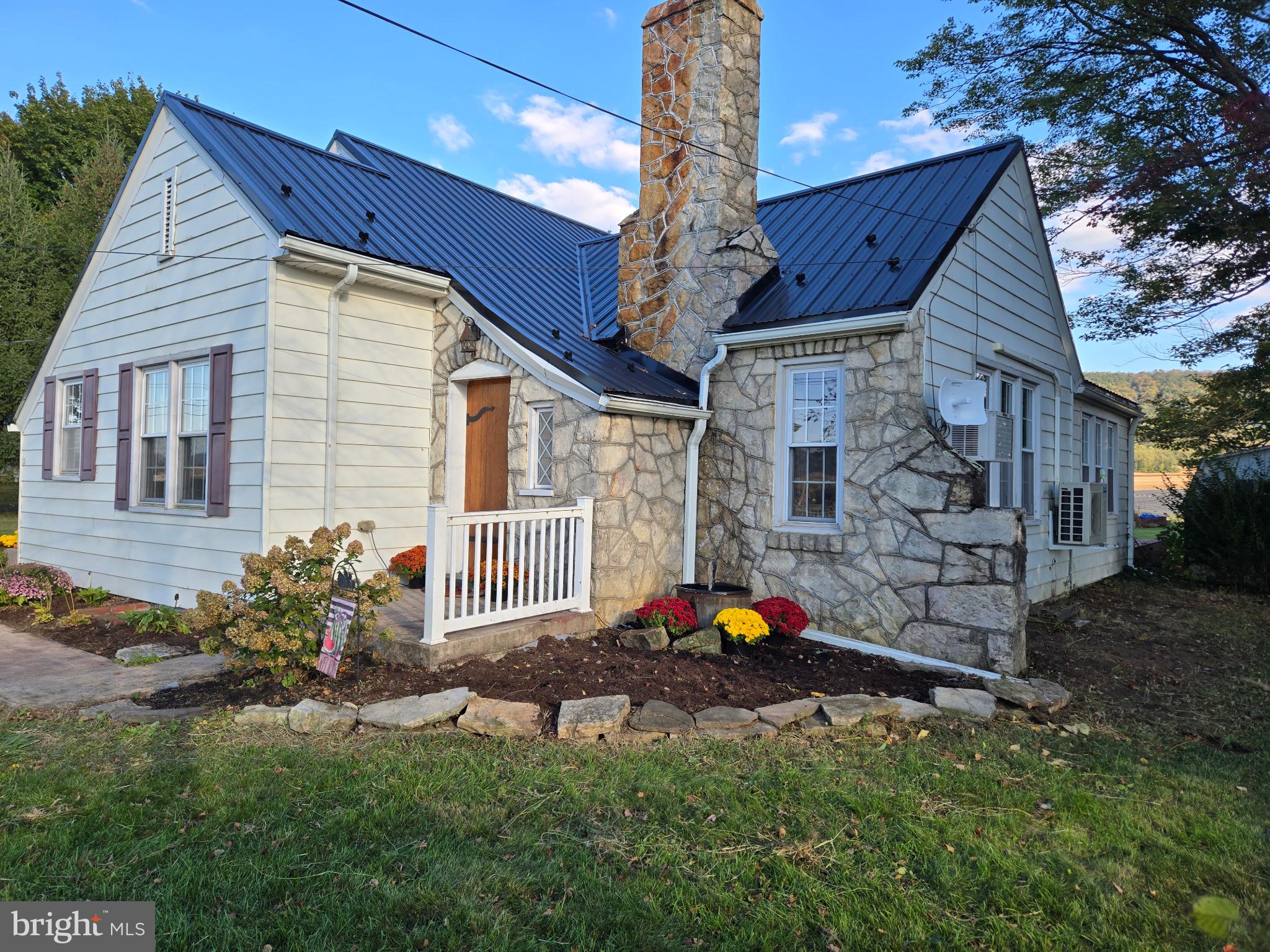 18452 Path Valley Road Dry Run, PA 17220 - Photo 2 of 45 a backyard of a house with table and chairs