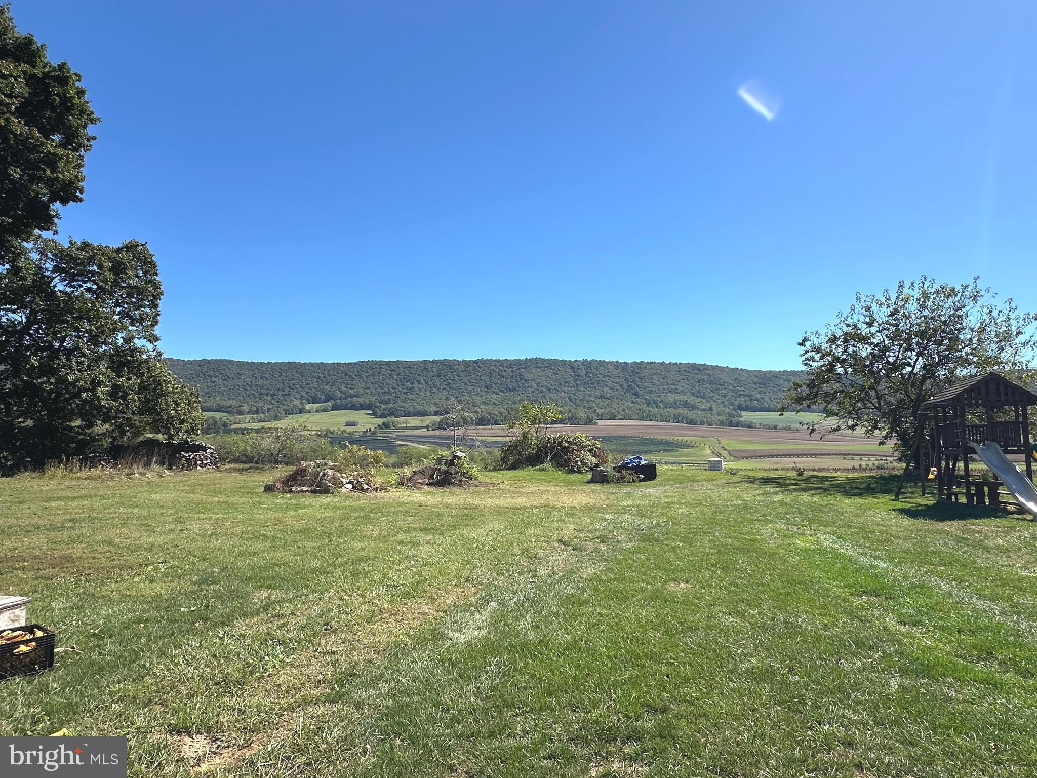 18452 Path Valley Road Dry Run, PA 17220 - Photo 39 of 45 a view of a lake with houses in the background