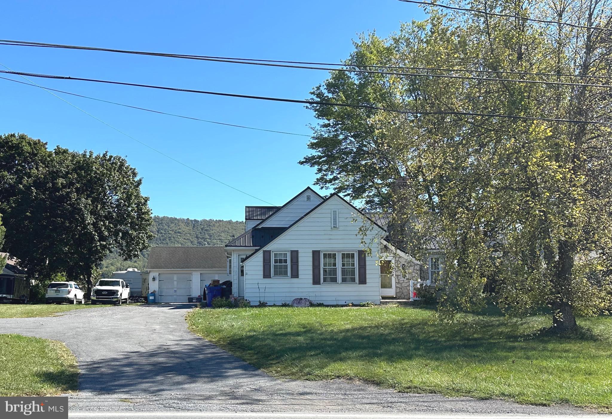 18452 Path Valley Road Dry Run, PA 17220 - Photo 42 of 45 a front view of a house with a garden