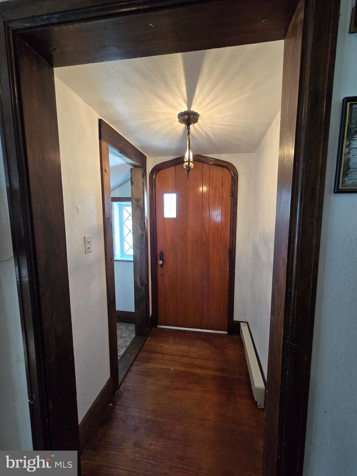 18452 Path Valley Road Dry Run, PA 17220 - Photo 5 of 45 a view of a hallway with a chandelier fan