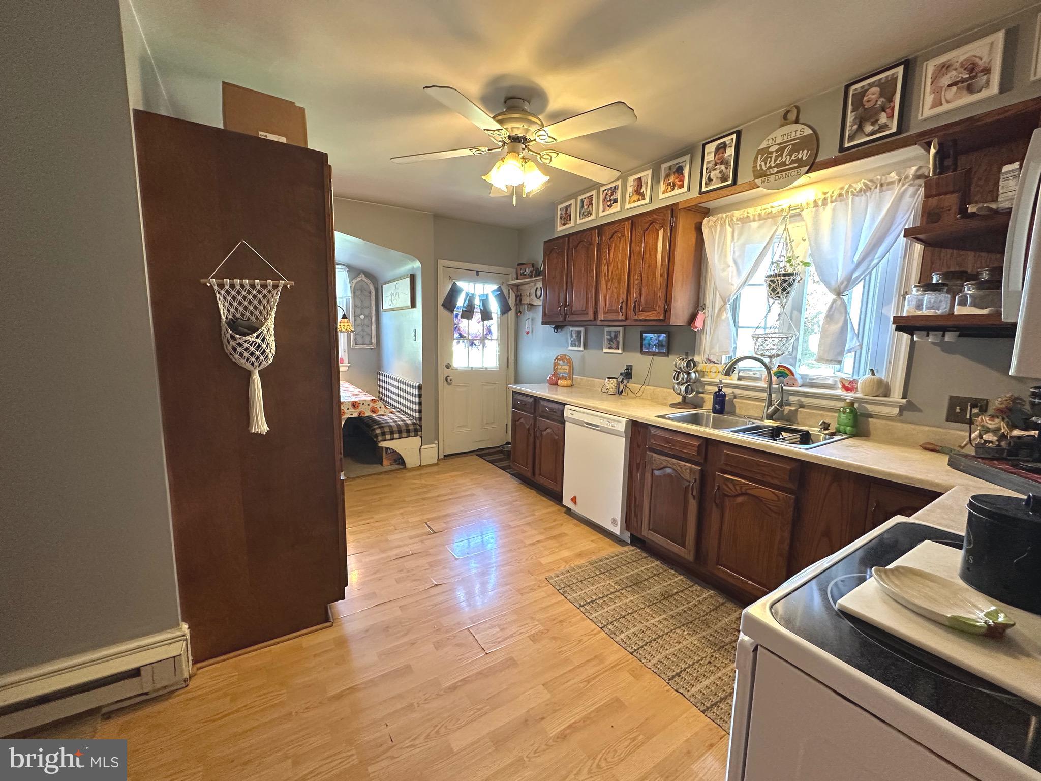 18452 Path Valley Road Dry Run, PA 17220 - Photo 10 of 45 a kitchen with a sink appliances cabinets and a window