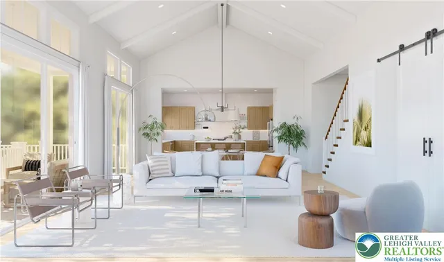 a living room with patio furniture and a chandelier