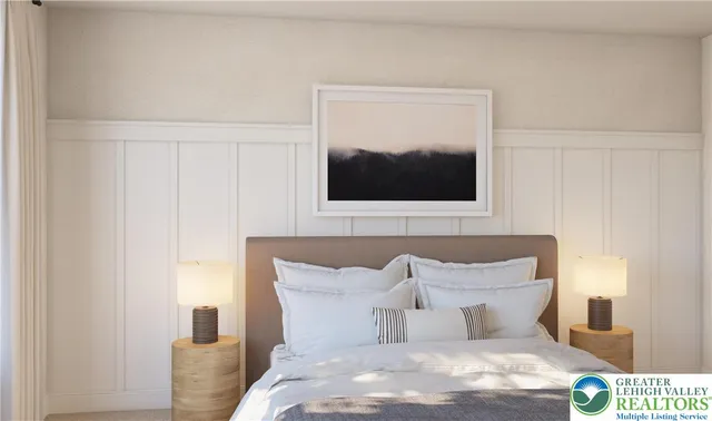 a bedroom with a bed and a television