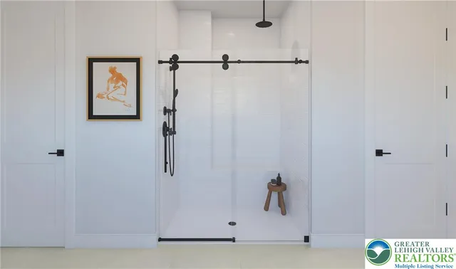 a large white bed in a white room