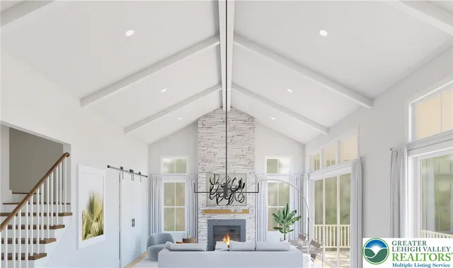 a living room with furniture and a chandelier