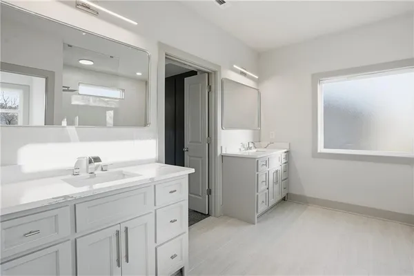 a bathroom with a bathtub and a shower