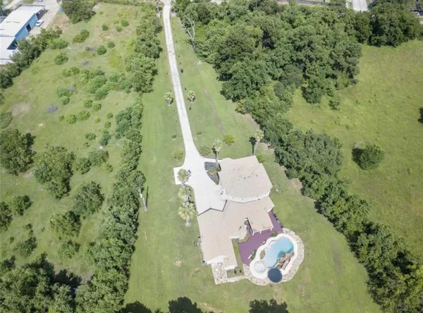 a view of a street with a yard