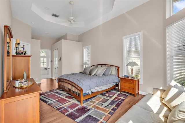 a bedroom with a bed and a table in it