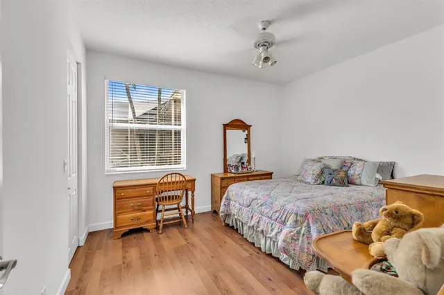 a bedroom with two beds and a window