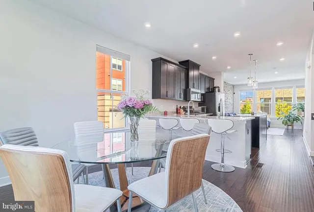 a view of a dining room with furniture window and wooden floor
