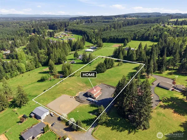 an aerial view of a house with a garden