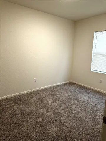 a bedroom with a workspace