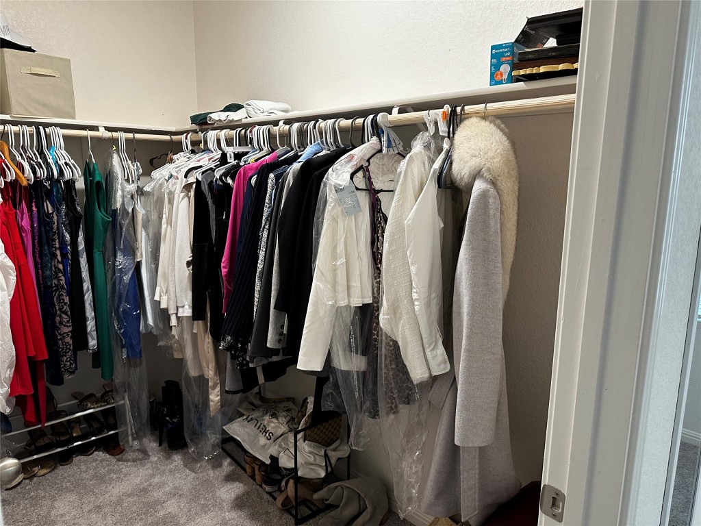 207 Enforcer Loop Jarrell, TX 76537 - Photo 10 of 15 a view of walk in closet with clothes