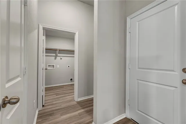 a view of a bathroom from the hallway