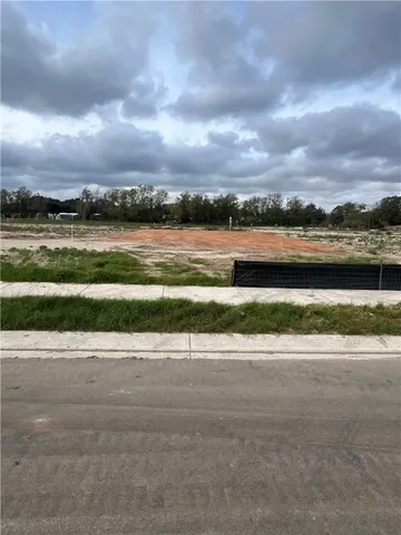 a view of a lake with a big yard