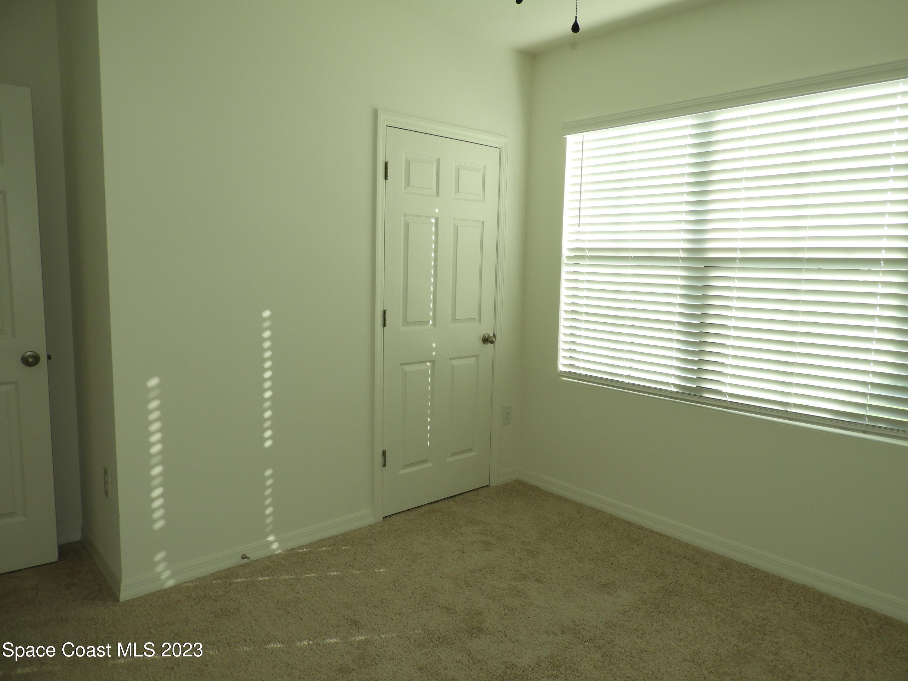 3782 Coachman Lane Southeast Palm Bay, FL 32909 - Photo 17 of 31 a view of an empty room with a window