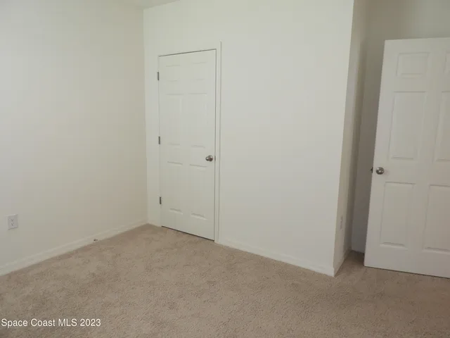 a view of a hallway with closet area