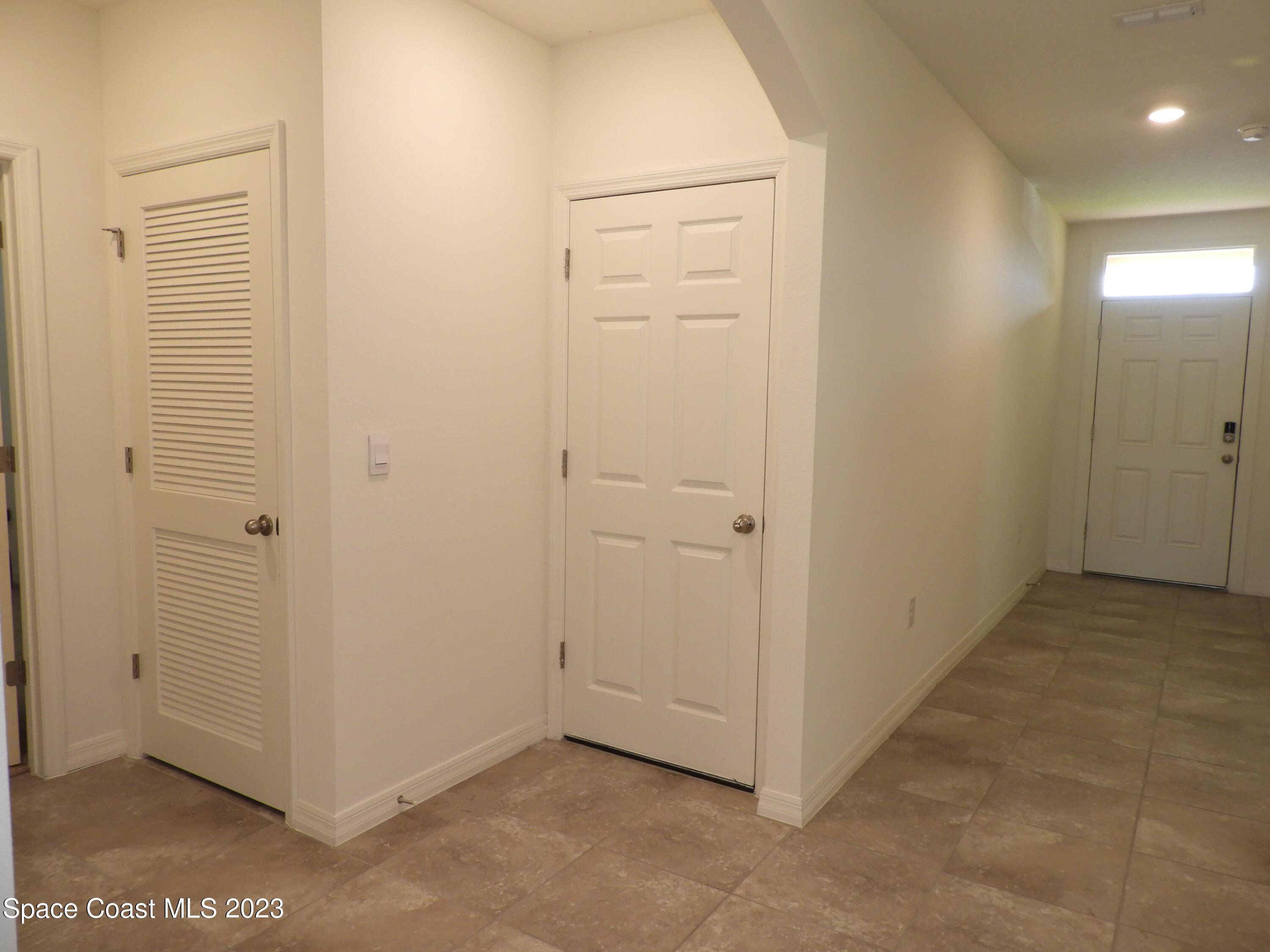 3782 Coachman Lane Southeast Palm Bay, FL 32909 - Photo 20 of 31 a view of a hallway with closet area