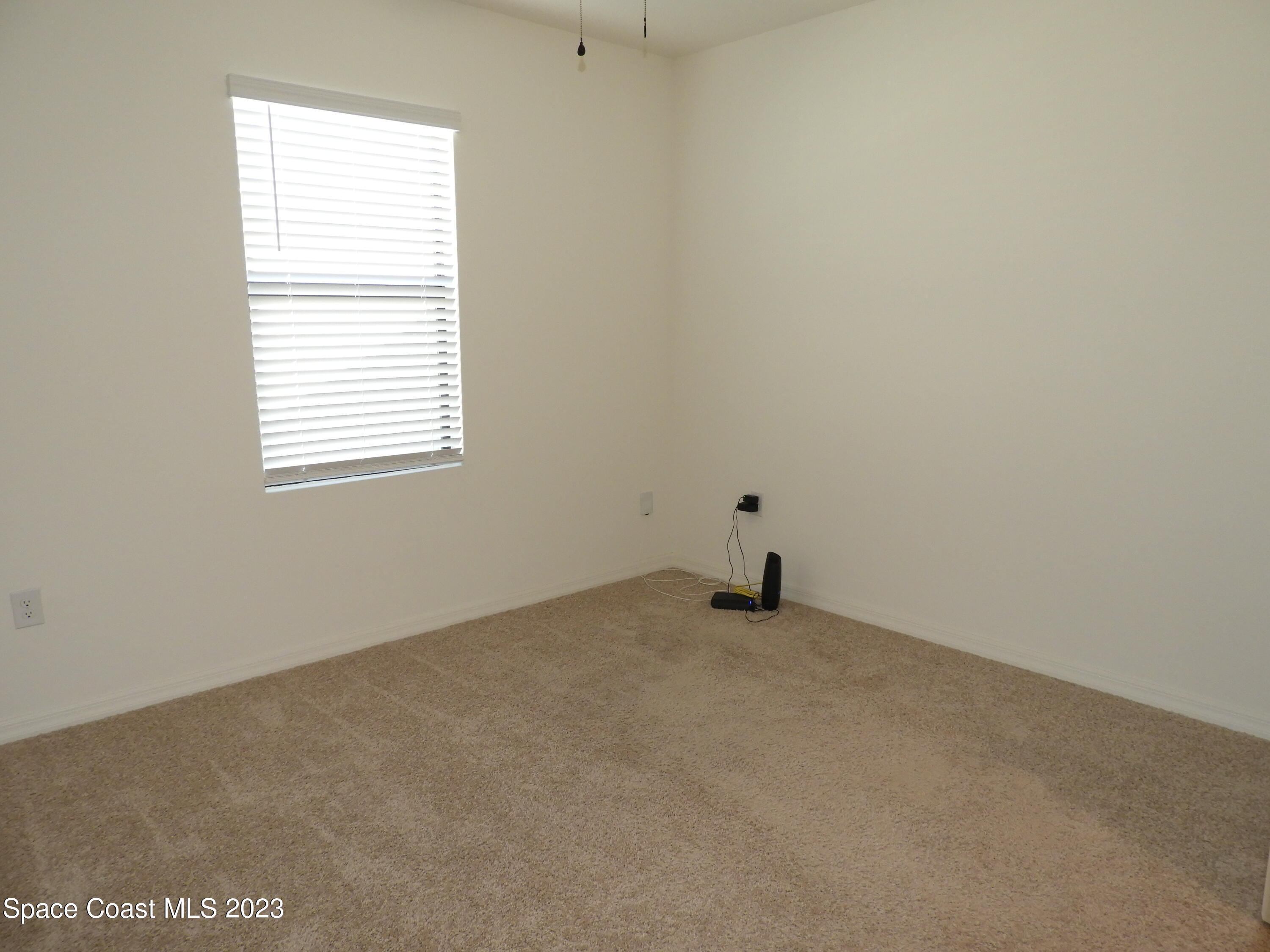 3782 Coachman Lane Southeast Palm Bay, FL 32909 - Photo 23 of 31 an empty room with a window