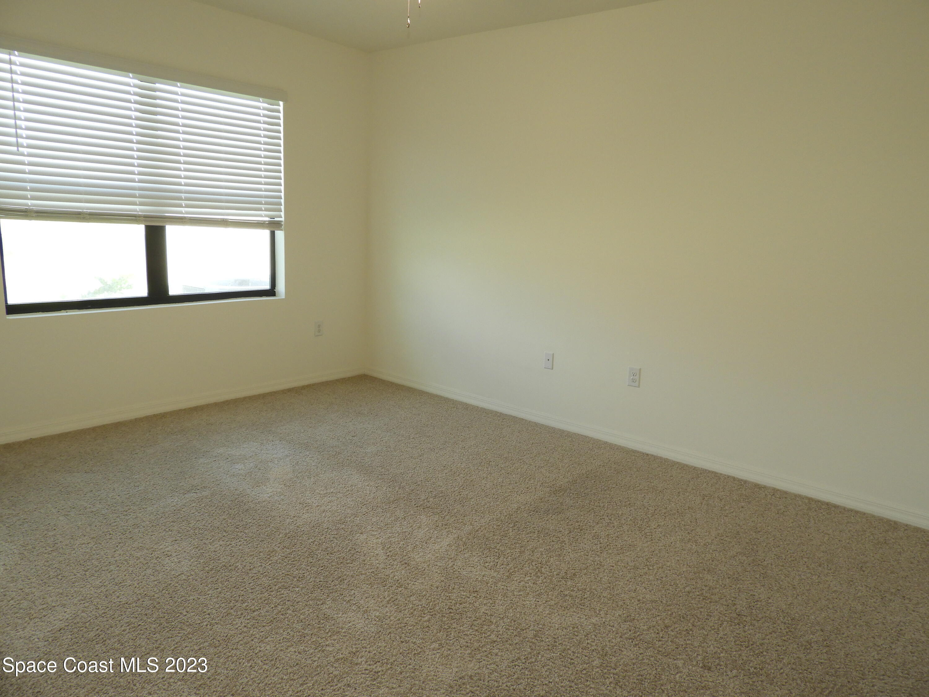 3782 Coachman Lane Southeast Palm Bay, FL 32909 - Photo 24 of 31 an empty room with a window