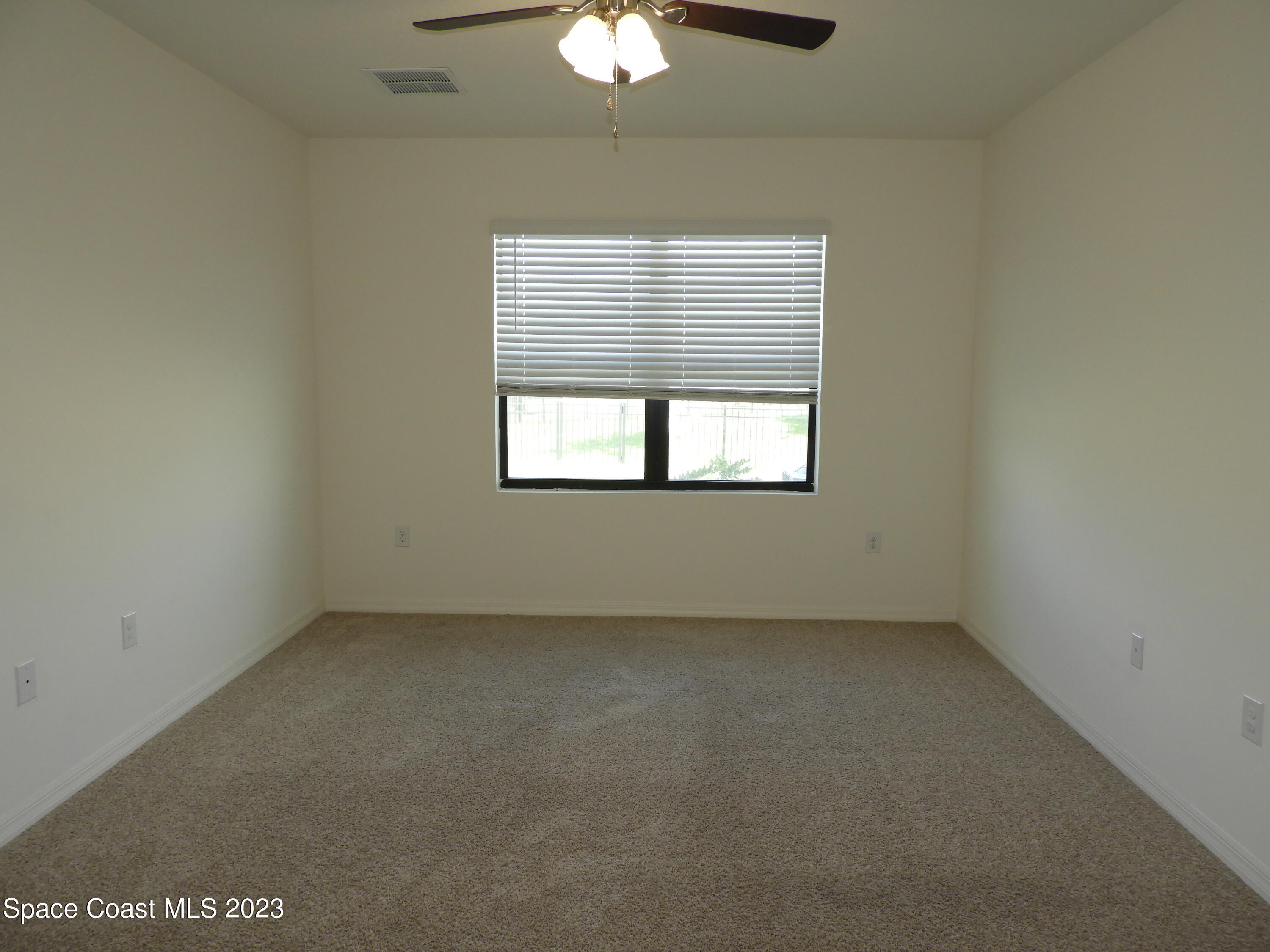 3782 Coachman Lane Southeast Palm Bay, FL 32909 - Photo 25 of 31 an empty room with a window