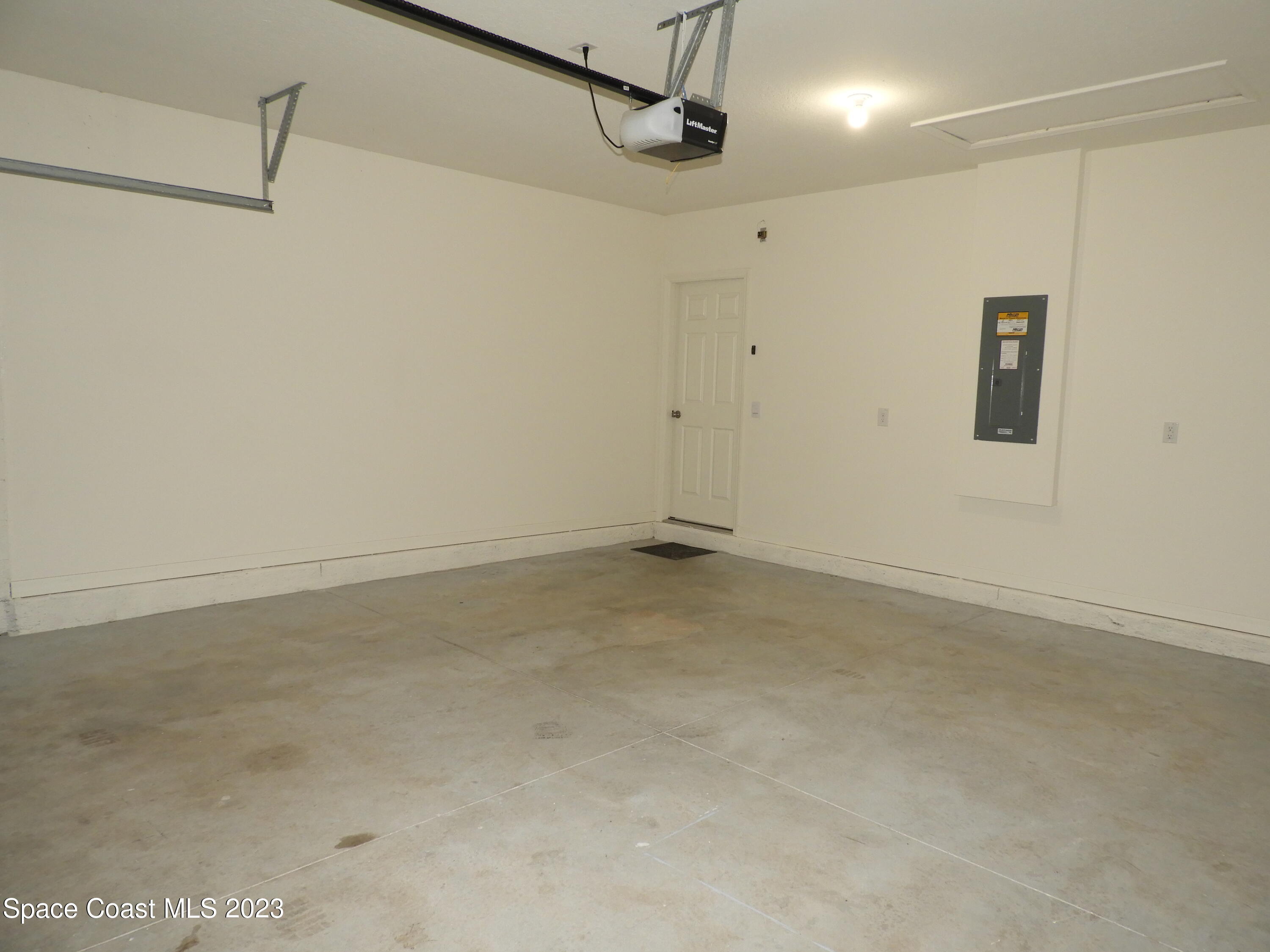 3782 Coachman Lane Southeast Palm Bay, FL 32909 - Photo 28 of 31 a view of a garage