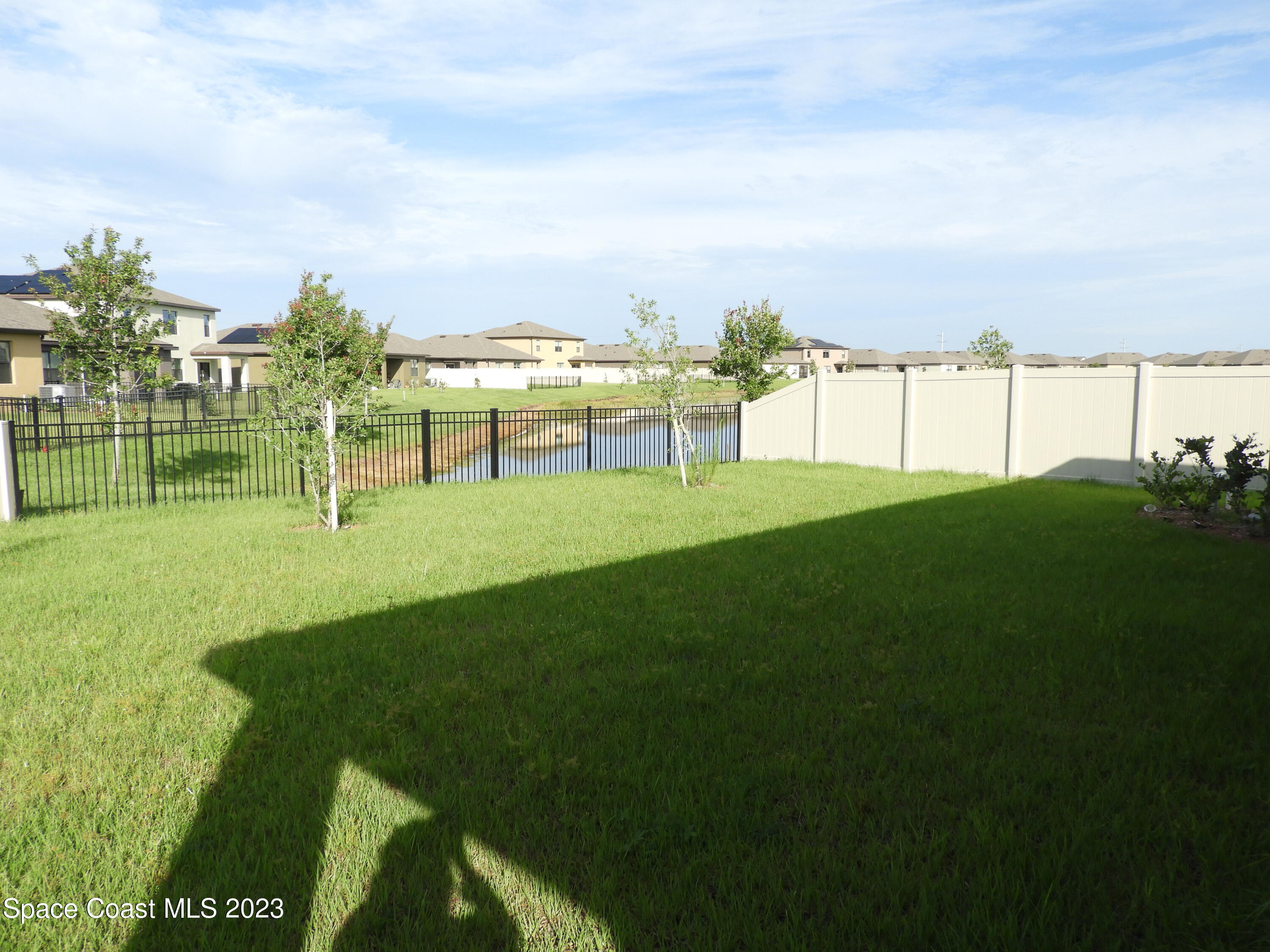 3782 Coachman Lane Southeast Palm Bay, FL 32909 - Photo 29 of 31 a view of a golf course with a garden