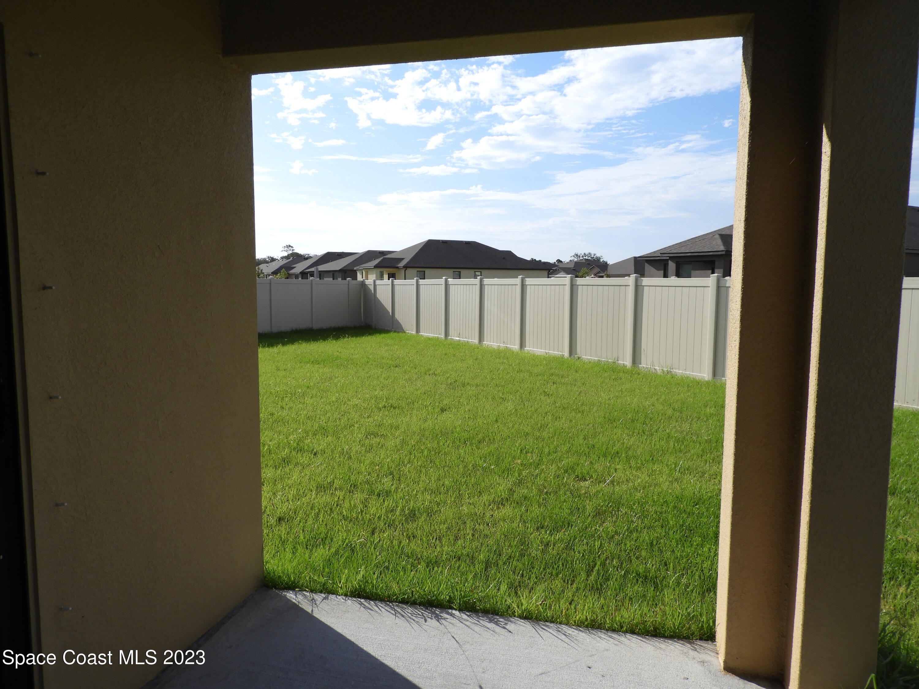 3782 Coachman Lane Southeast Palm Bay, FL 32909 - Photo 30 of 31 a view of a back yard from a balcony