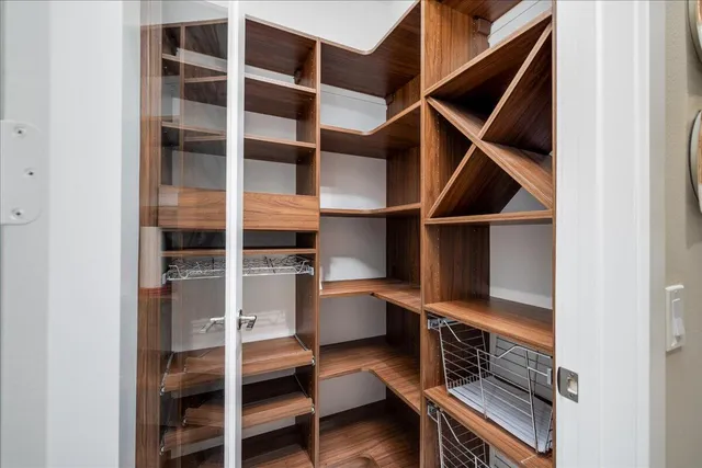 a kitchen with stainless steel appliances kitchen island granite countertop a sink and cabinets