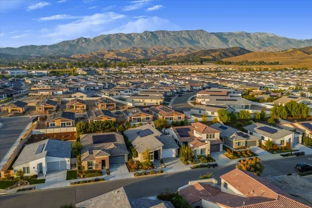 an aerial view of residential houses and outdoor space