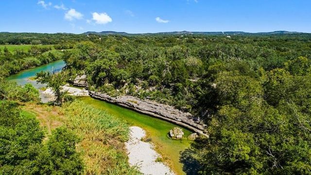 a view of a yard with a lake view