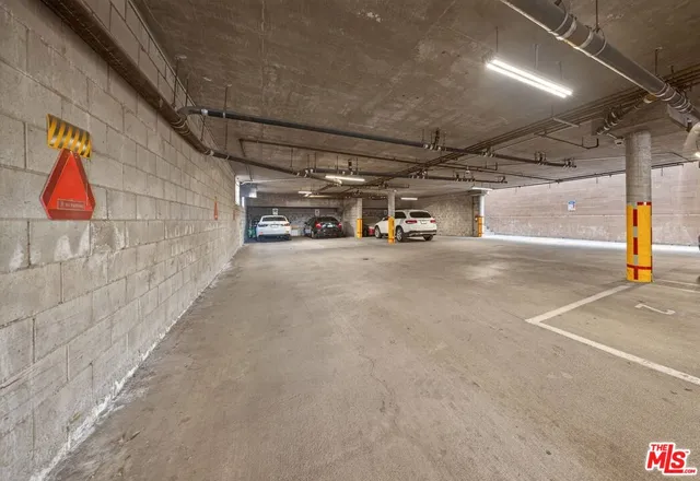 a view of a garage with cars