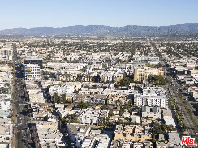 an aerial view of residential building and trees