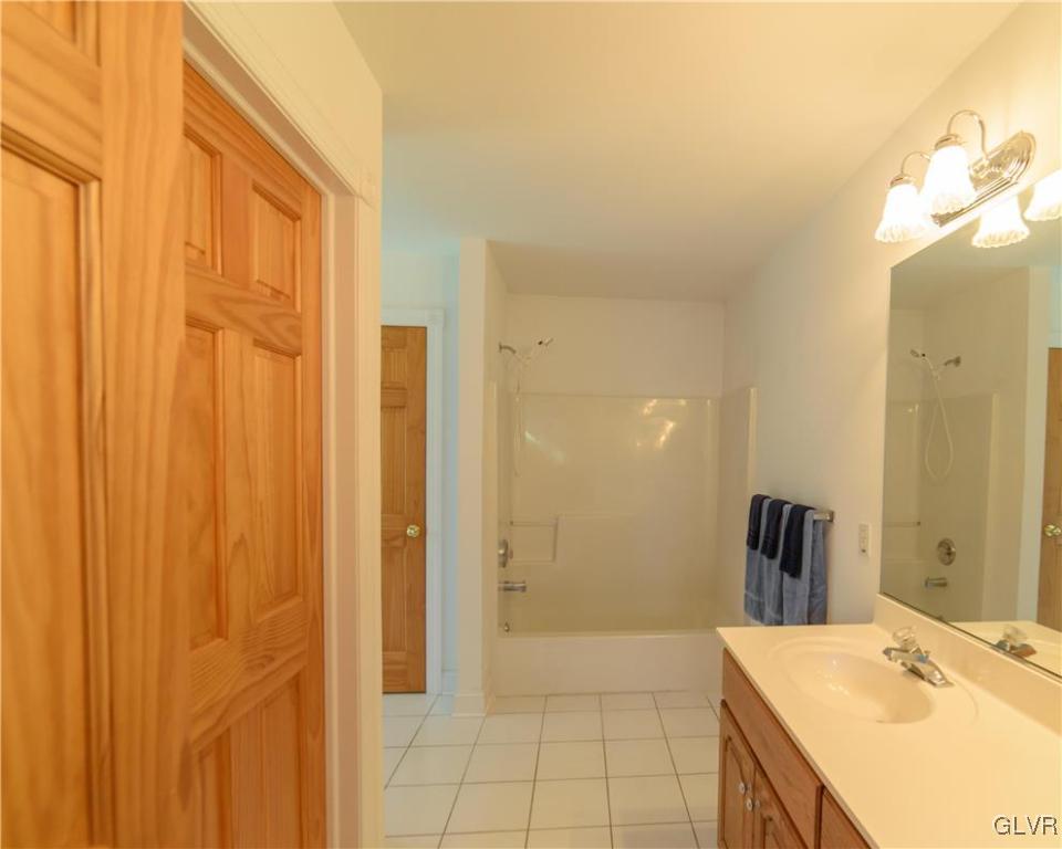 1213 Seifert Road Nazareth, PA 18064 - Photo 14 of 25 a bathroom with a granite countertop sink and a mirror